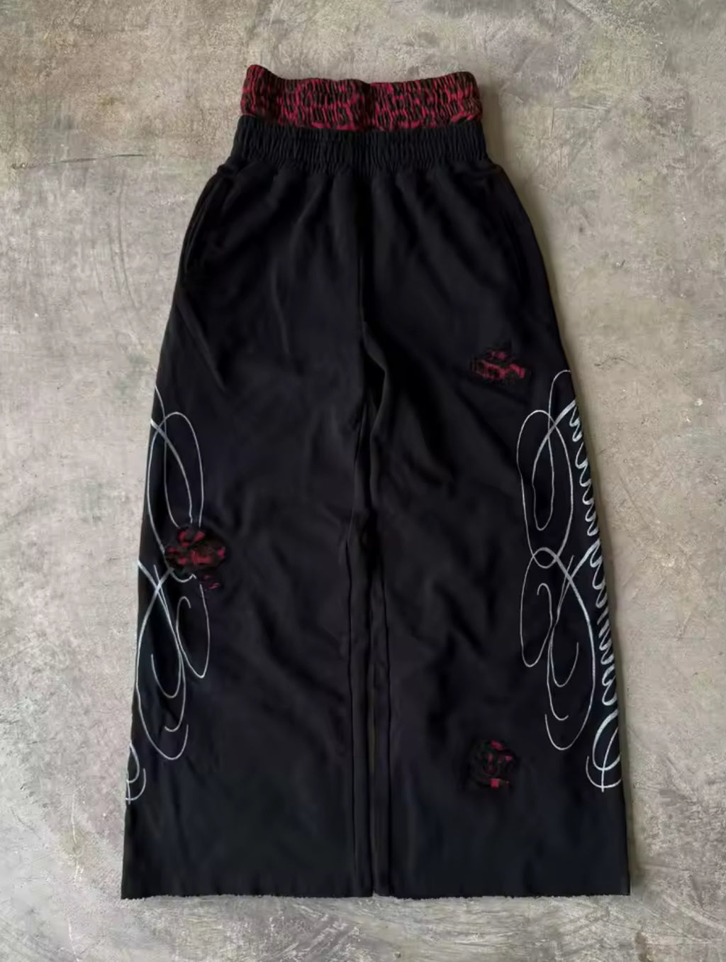 Black & red double-waist baggy sweatpants with cursive design