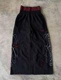 Black & red double-waist baggy sweatpants with cursive design